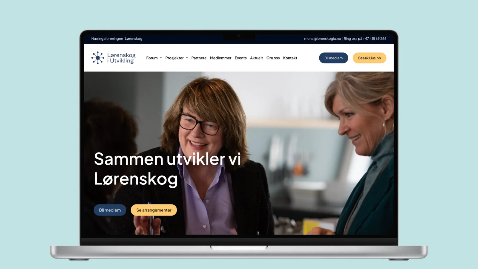 Forsiden av lorenskogiutvikling.no vist på en laptop, med overskriften «Sammen utvikler vi Lørenskog» over et foto av to kvinner i samtale, og knappene «Bli medlem» og «Se arrangementer».
